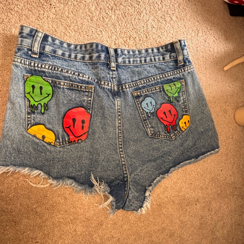 Summer shorts with smiley faces on the back pockets.